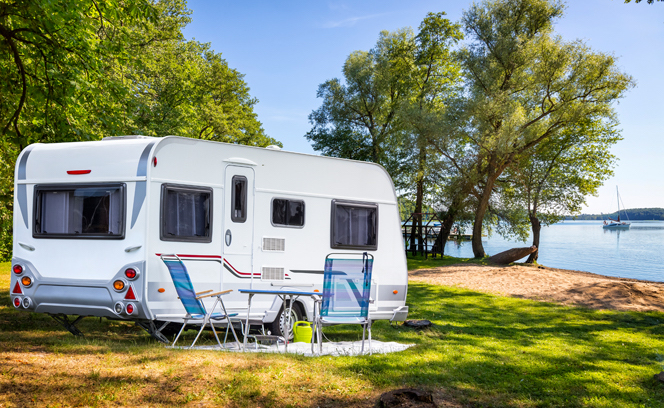 caravan facing the river